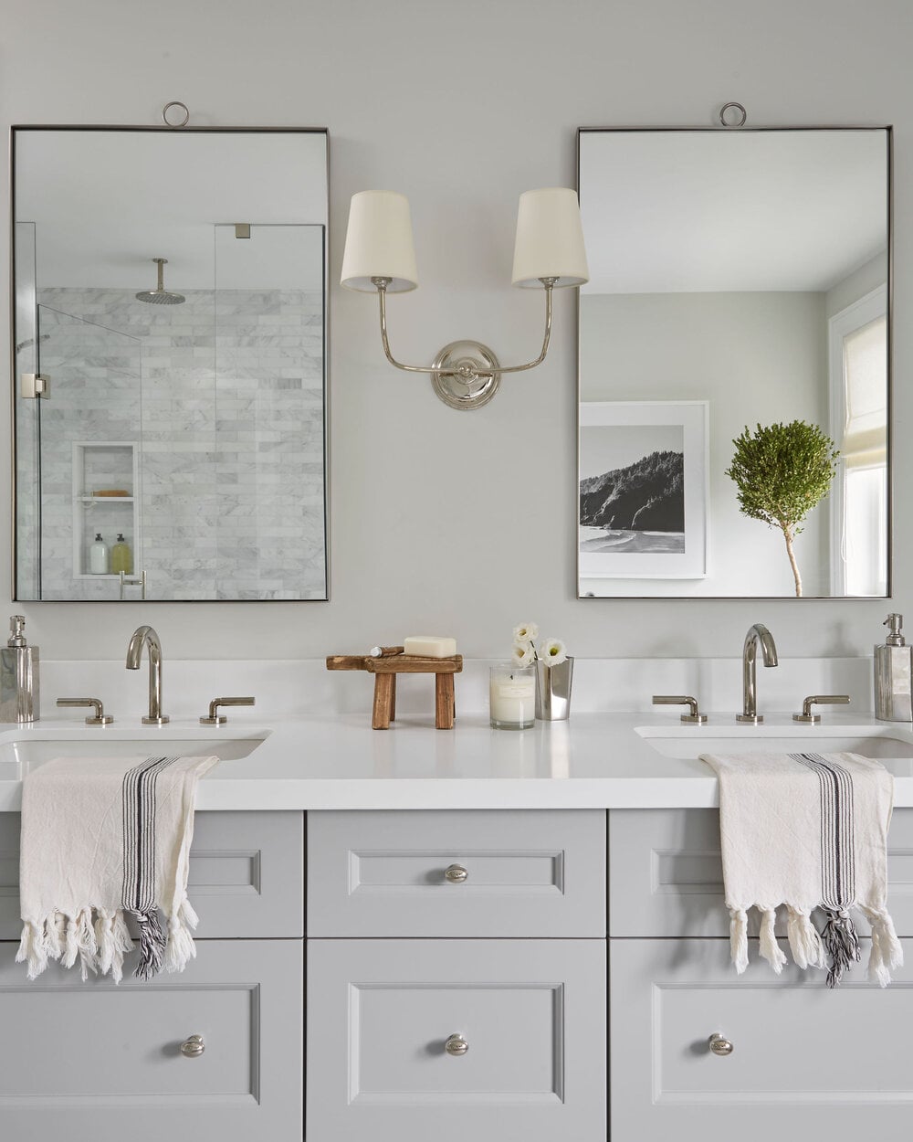 Traditional bathroom vanity featuring a brushed nickel faucet, paired with a classic white sink and dark wood cabinetry.