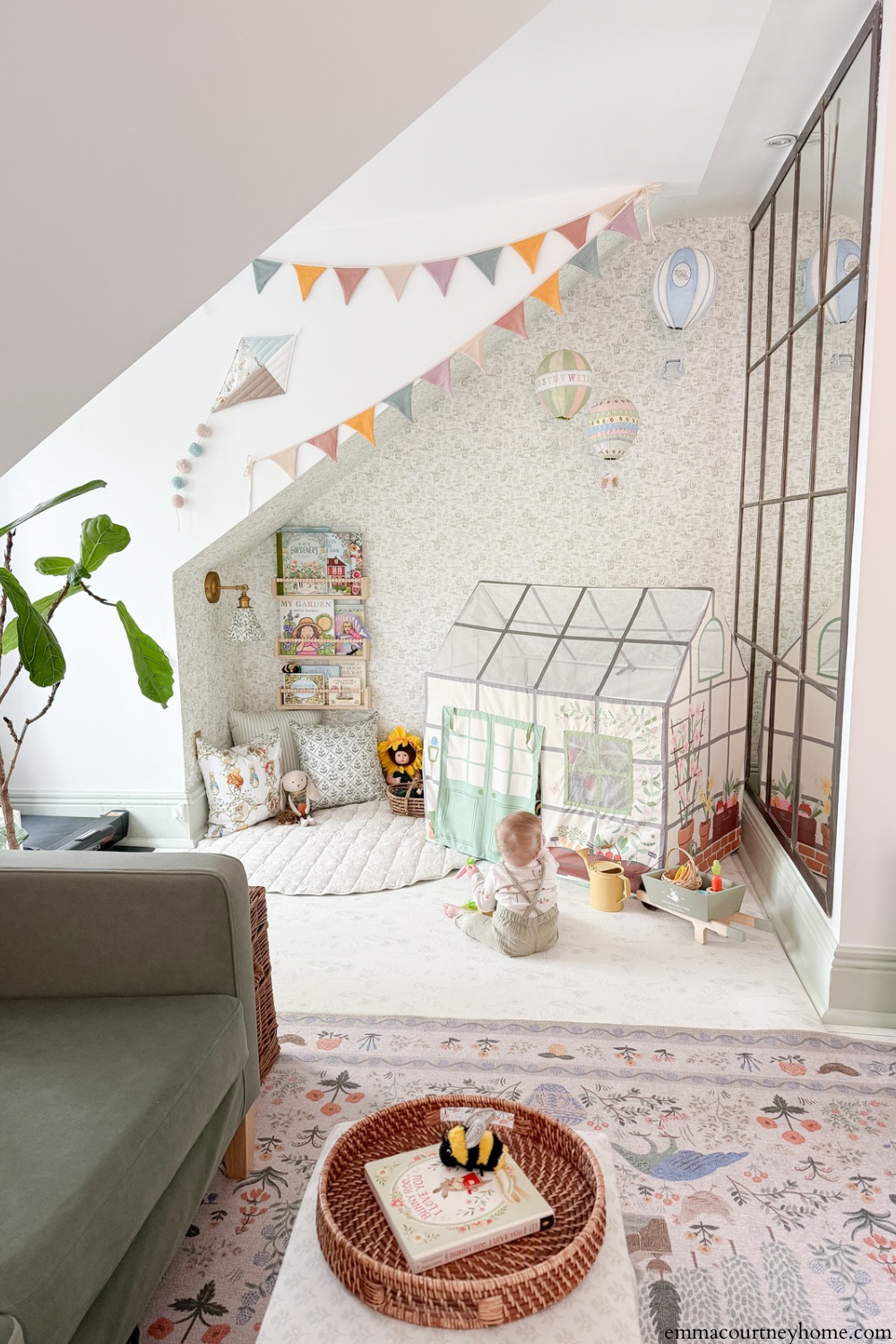 DIY paper mache hot air balloons hanging from the ceiling with bunting flags