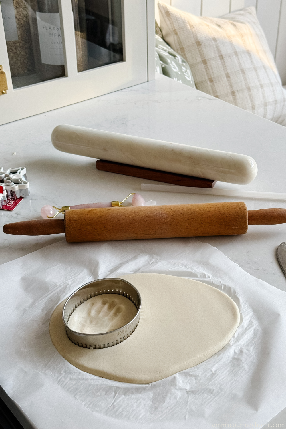 Use a scalloped oval cutter to shape your Salt Dough Baby Handprint Ornament. This simple detail gives the ornament a charming vintage look.