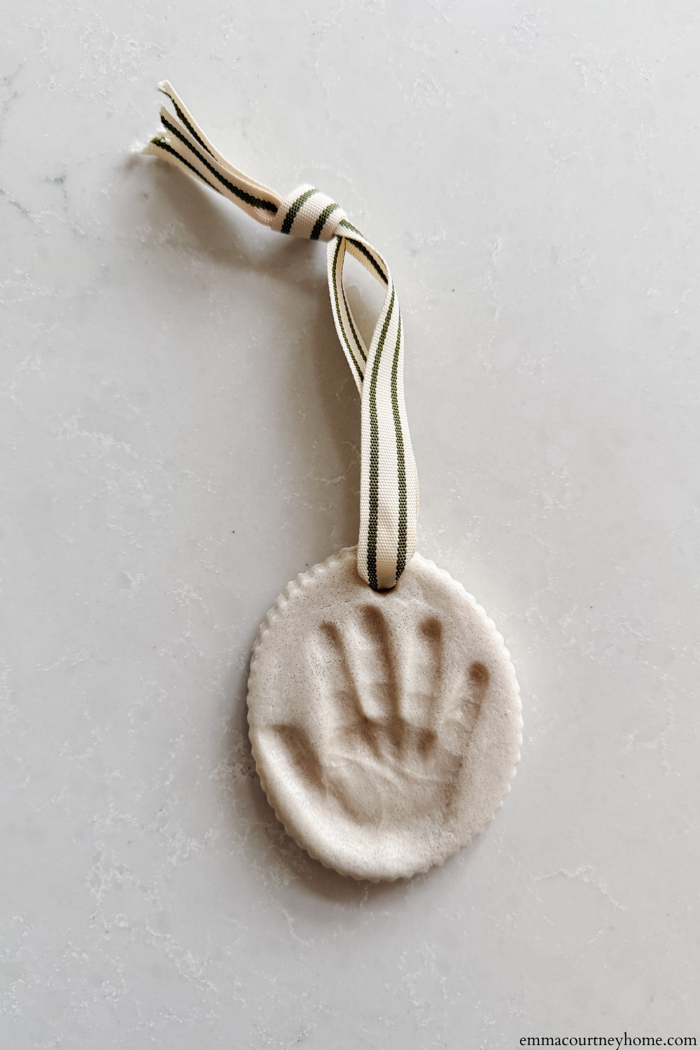 This Salt Dough Baby Handprint Ornament captures every tiny detail. A beautiful newborn keepsake made using soft salt dough and a scalloped cutter.