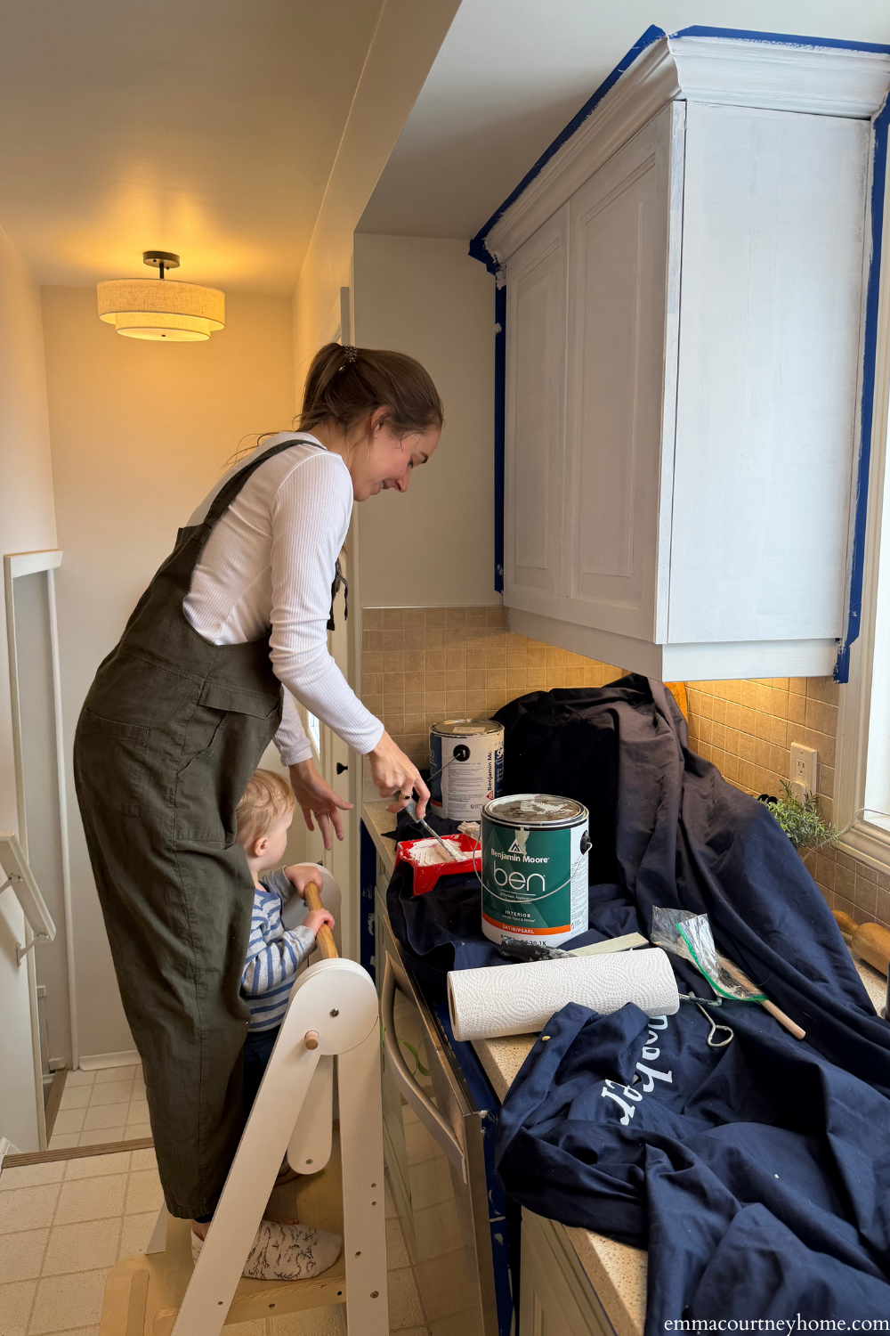 Painting kitchen cabinets during a budget-friendly kitchen makeover