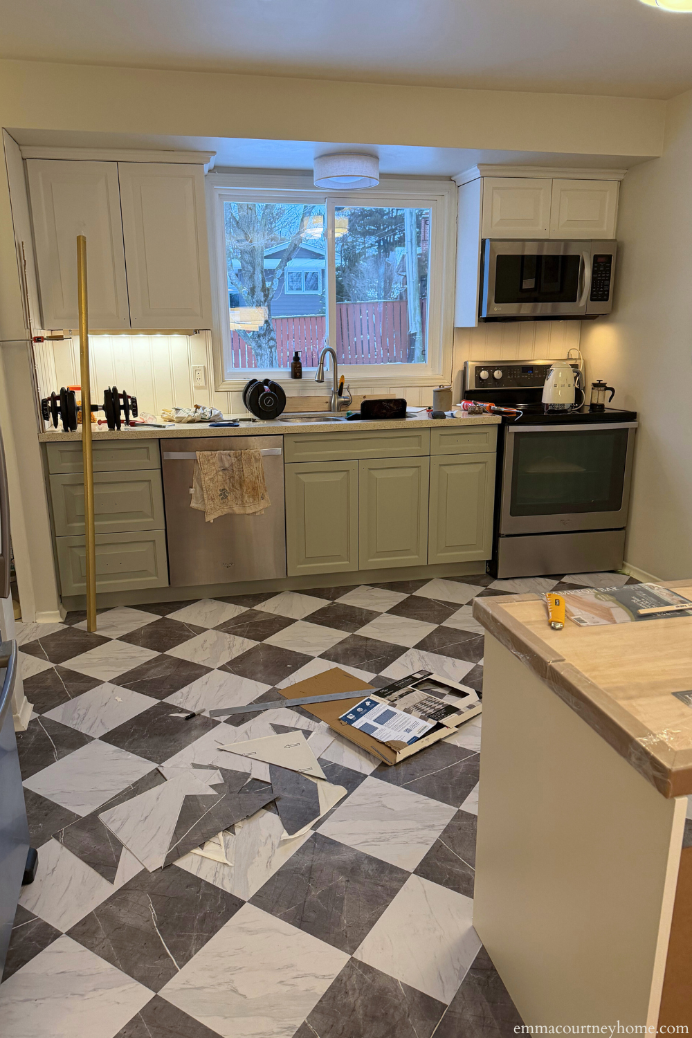 Peel and stick tile kitchen floor installed during a budget-friendly kitchen makeover