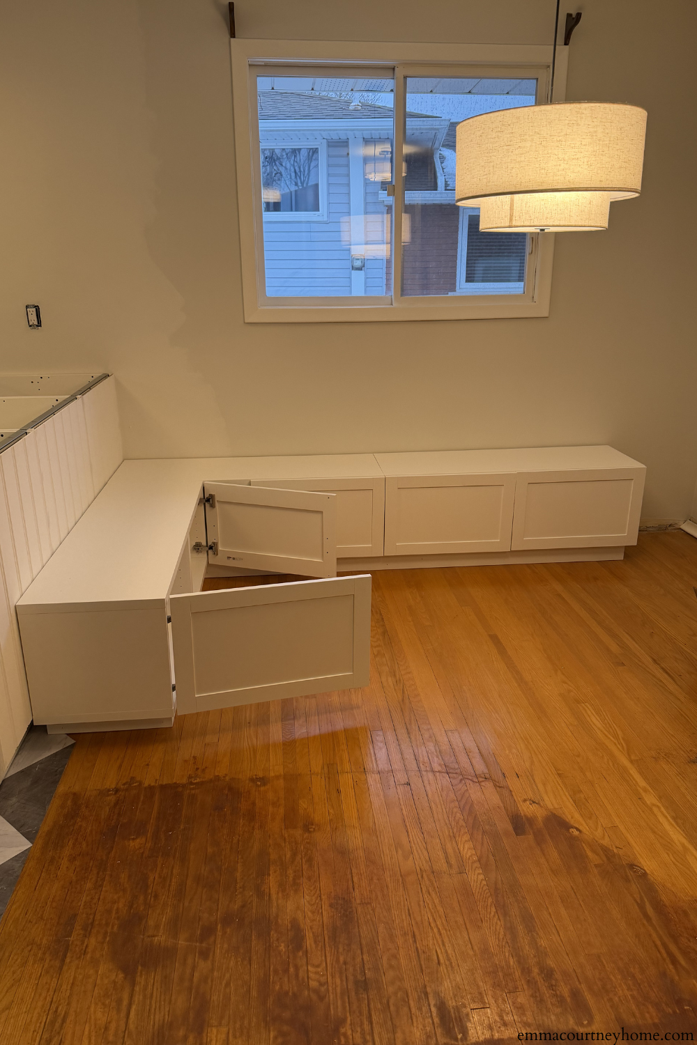 IKEA Besta cabinets installed on base for banquette seating